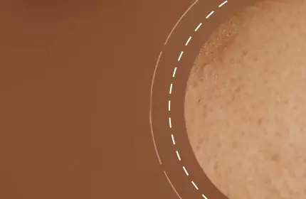An abstract image featuring a close-up of skin texture against a brown background, with a circular design element.