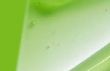 Abstract design featuring a gradient of vibrant green shades with smooth, flowing textures.