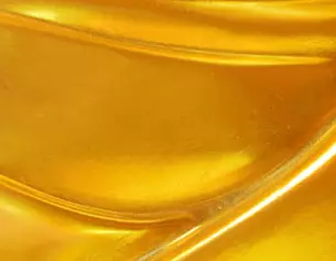 Gouden, glanzende textuur met subtiele golvende patronen.