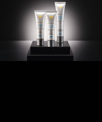 One jar of SkinCeuticals P-TIOX Cream on a sleek dark background with a clear serum droplet.